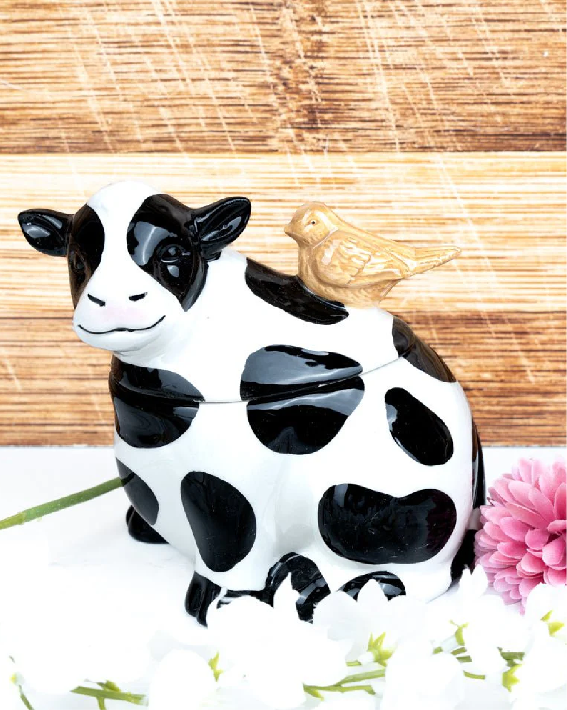 Bird on cow ceramic treat jar “5.75” in